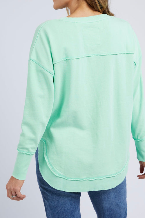 model wears a mint sweatshirt