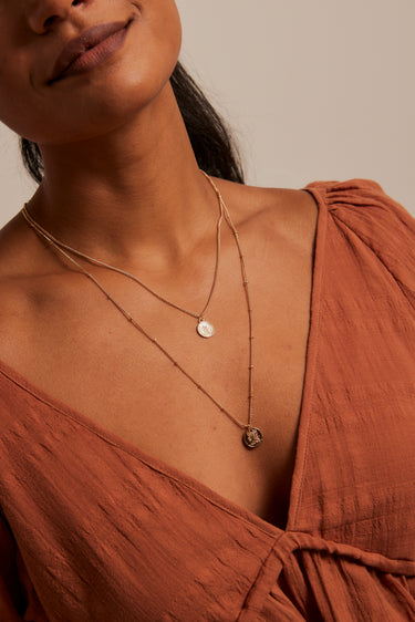 model wearing Double Layered Coin Gold Necklace