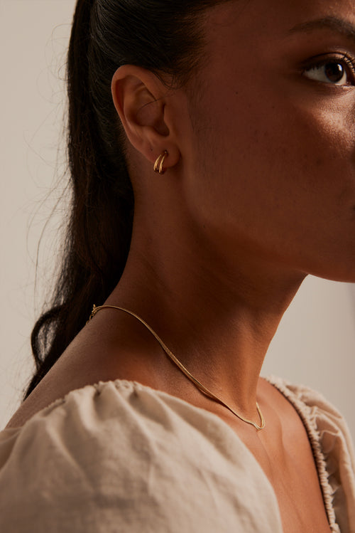 model wearing Double Loop Gold Earrings