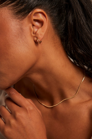 MODEL WEARING Double Loop Gold Earrings