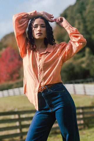 model wears a orange shirt