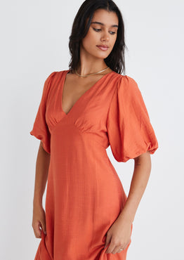 Model wears Orange Puff Sleeve Midi Dress