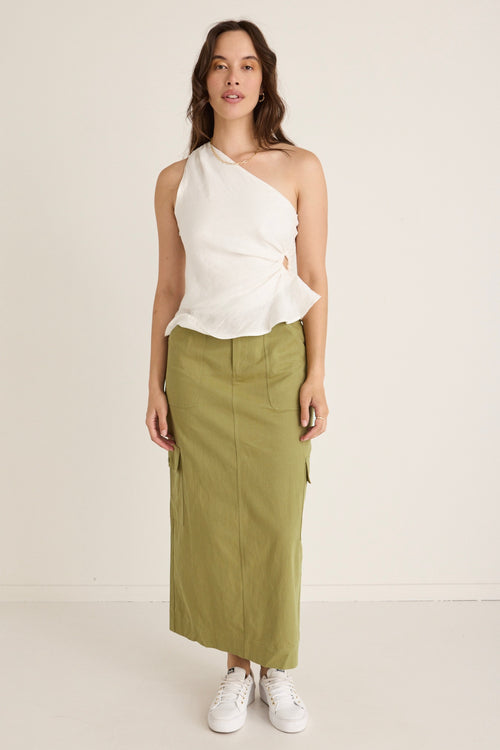 model wears a green skirt