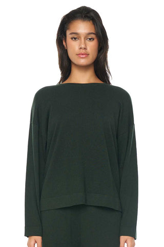 model wears a green knit