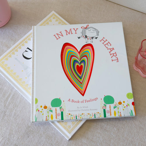 Book titled 'In My Heart' with a colorful heart illustration on a light surface.