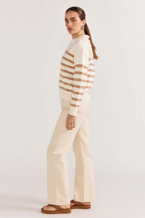 model wears a beige stripe knit