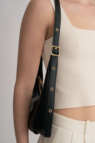 model wears a black handbag