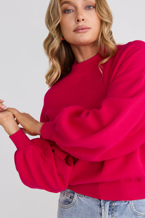model wears a pink knit