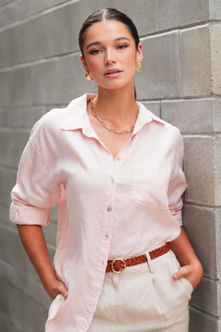 model wears a pink linen shirt
