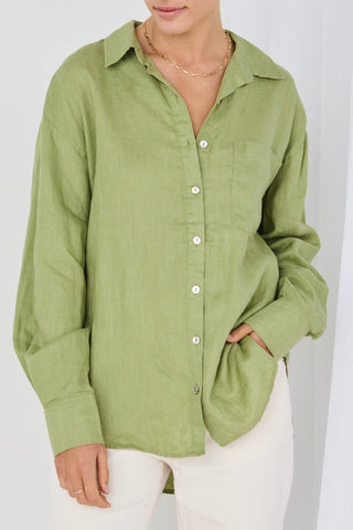 model wears green linen shirt