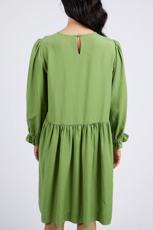 model wears a Green Mini Dress