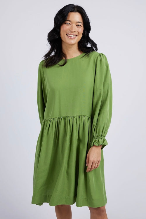 model wears a Green Mini Dress