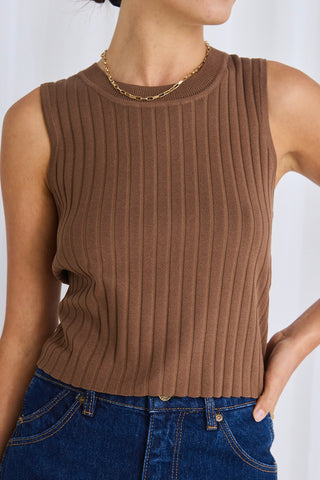 model wears a brown rib knit top