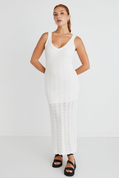model in long white knit dress