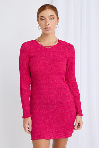 model wears a pink mini dress