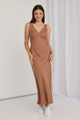 model wears a brown slip dress