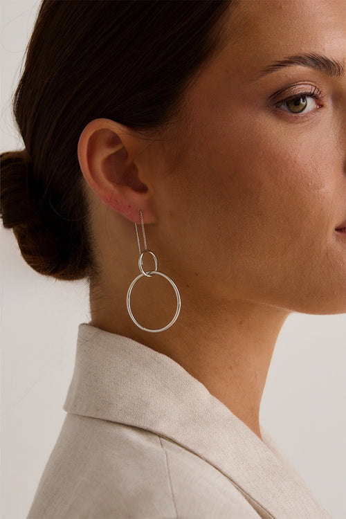 model wears silver hoop earring