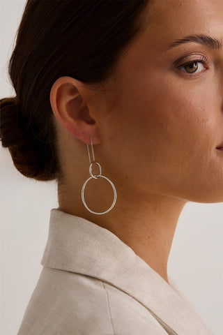 model wears silver hoop earring