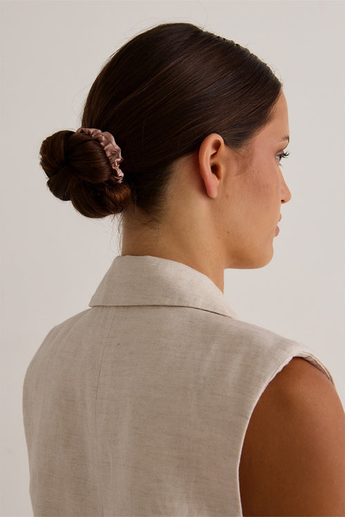 Model wears a rose scrunchie