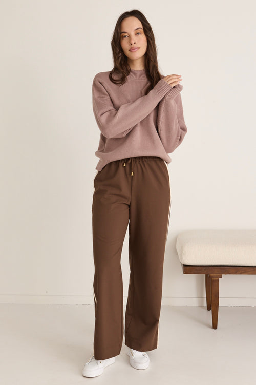 model wears a brown knit jumper