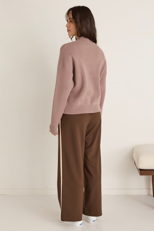 model wears a brown knit jumper