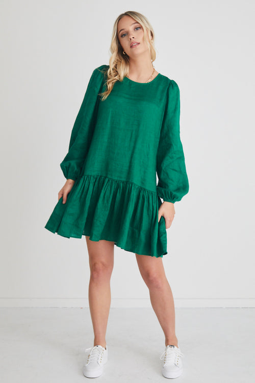 Model wears a green long sleeve mini dress
