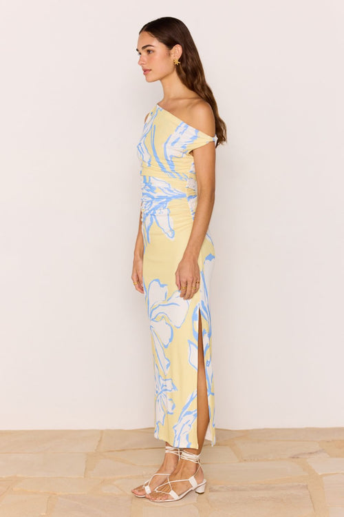 Model wears a yellow blue ruched dress