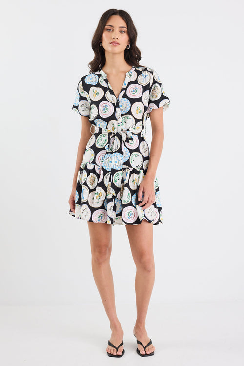 Woman wearing a floral dress on a white background