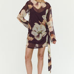 Woman wearing a floral dress on a white background