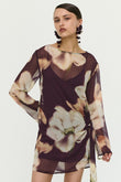 Woman wearing a floral dress on a white background