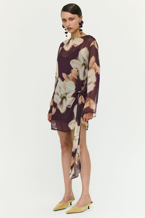 Woman wearing a floral dress on a white background