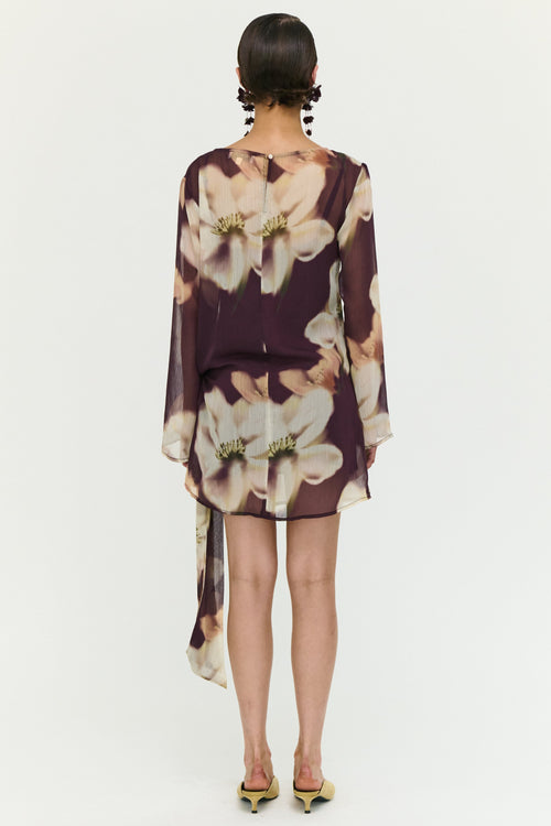Woman wearing a floral dress with a white background