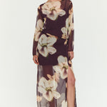 Woman wearing a floral dress on a white background