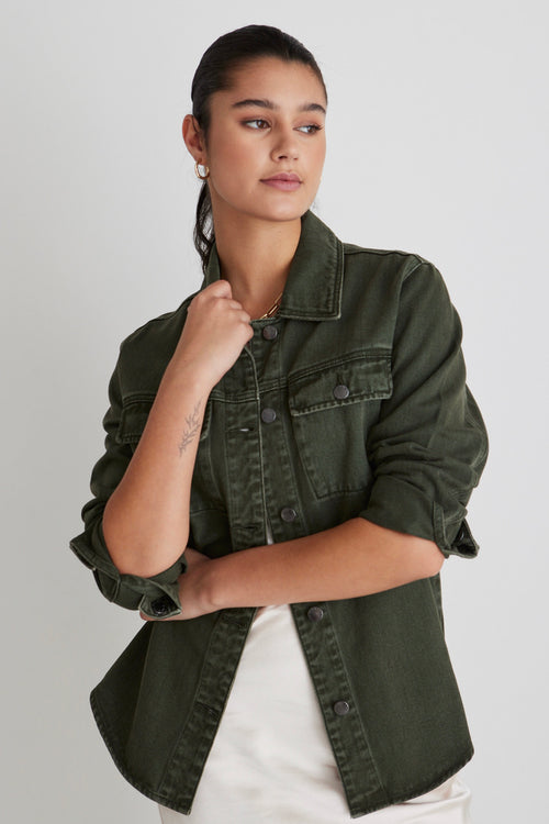 Model wears a green denim shacket