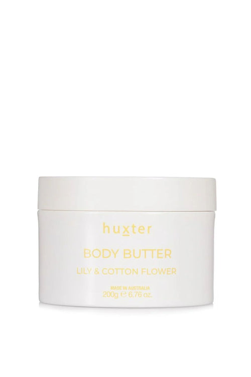 An open white jar of Huxter body butter in the scent 