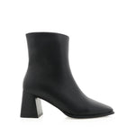 Black ankle boot with a block heel on a white background