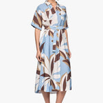 model wears a blue white brown pattern midi shirt dress