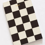 Checkered notebook with 'Diaries' text on a white background