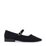 Black velvet loafers on a light gray background