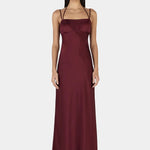 Model wears a burgundy event dress