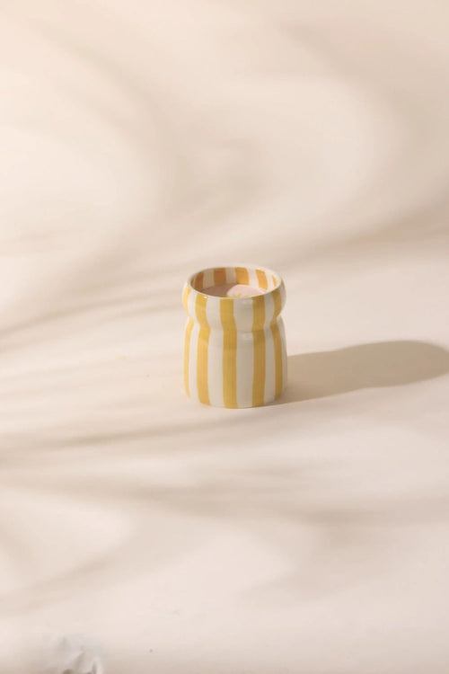yellow striped candle