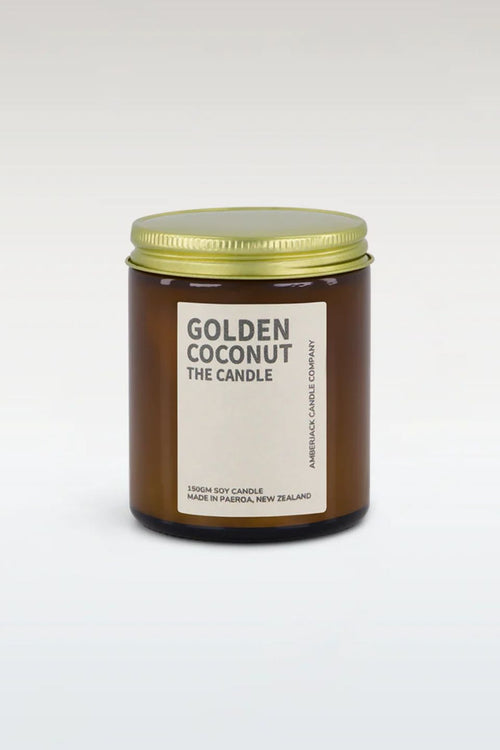Candle jar labeled 'Golden Coconut' on a white background