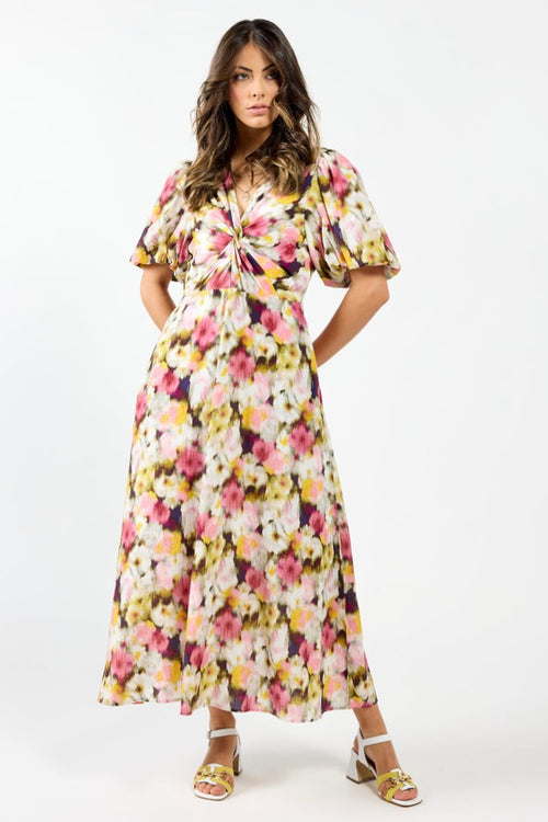 model wears a pink floral maxi dress