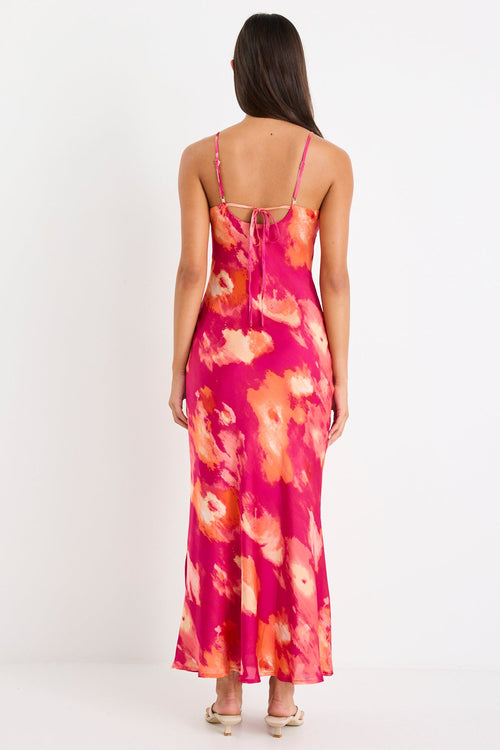 Woman wearing a floral dress on a white background