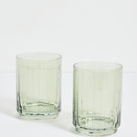 two green ribbed tumblers