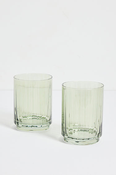 two green ribbed tumblers
