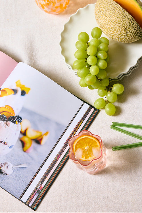 Fruits and a magazine on a light surface