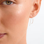 Close-up of a woman's face with a minimal background