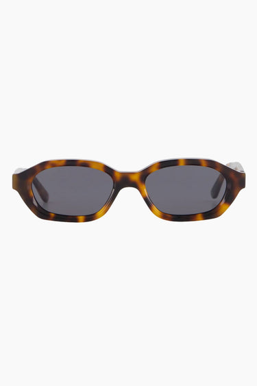 model wears a brown tort sunglass