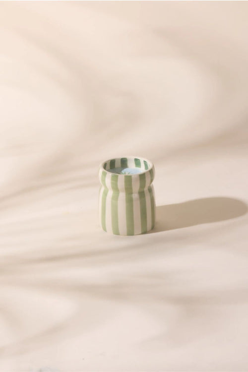 green and white striped candle